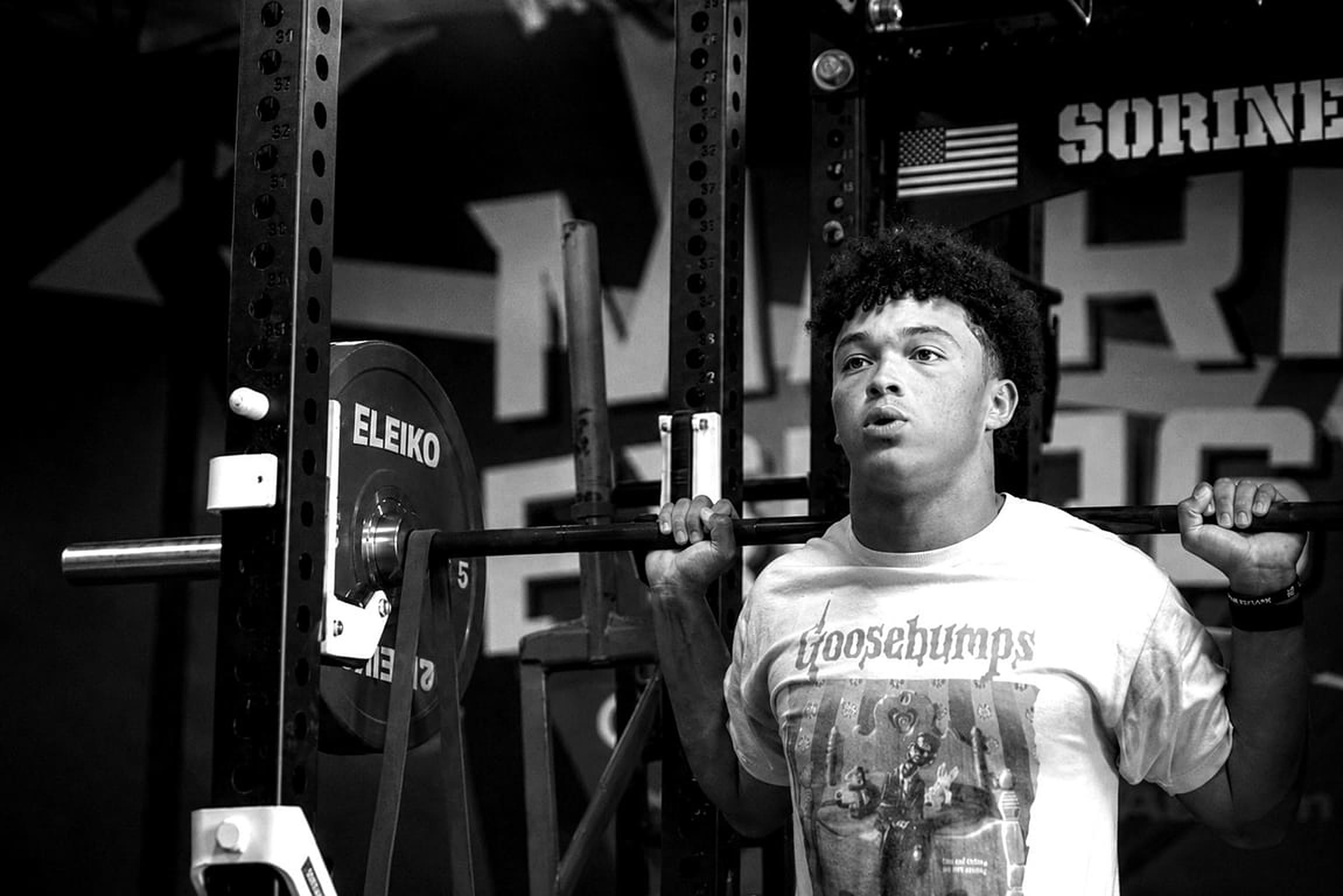 An athlete setting up under the bar at MARR STRENGTH, Southlake.