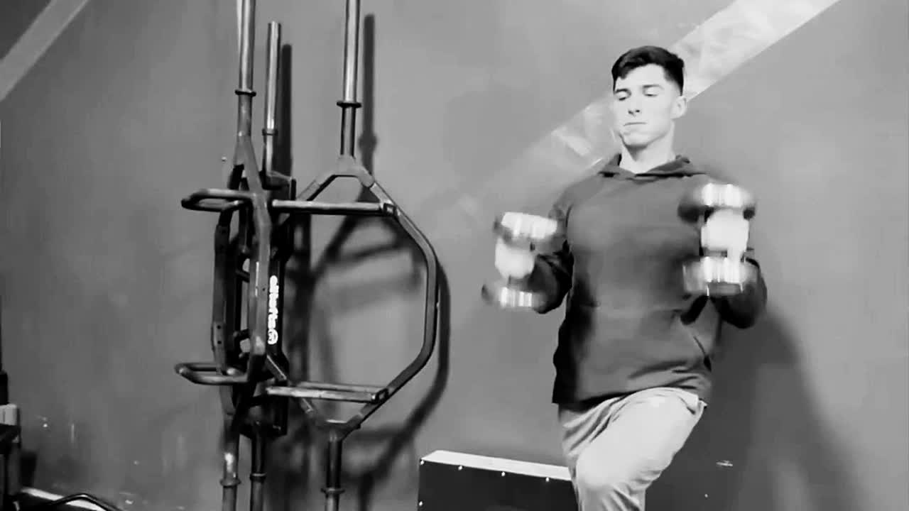 An athlete working through a set on the training floor.